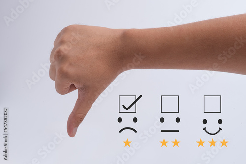 Bad review, bad service dislike bad quality, low rating, social media not good. Customer Experience dissatisfied Concept, Unhappy Businessman Client with Sadness Emotion Face on digital screen.