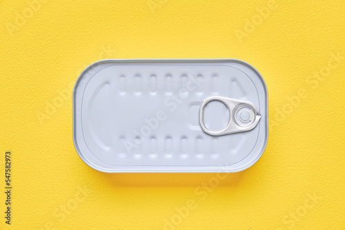 Square canned food on a yellow background.