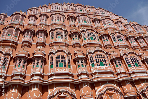 Hawa Mahal palace Jaipur, India. Facade of the palace of winds. Five floor exterior built like honeycomb with small windows decorated with intricate latticework.