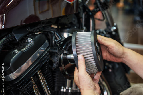 mechanic check Motorcycle air filter in garage, Backing plate promotes smooth airflow . motorcycle maintenance,repair concept