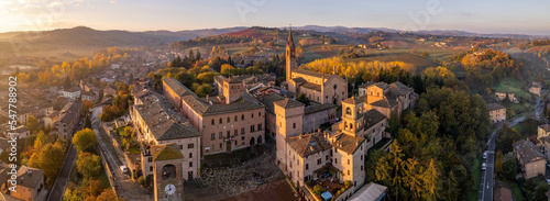 Lovevy aerial panoramic view of Castelvetro di Modena at sunrise among vineyards on Fall season