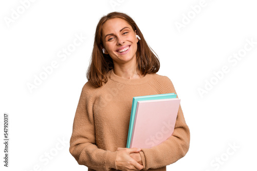 Young student woman holding a books isolated happy, smiling and cheerful.