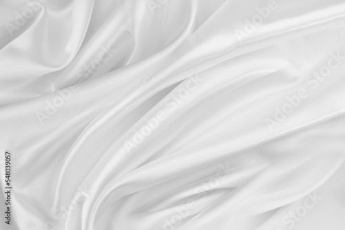Rippled white silk fabric texture background 