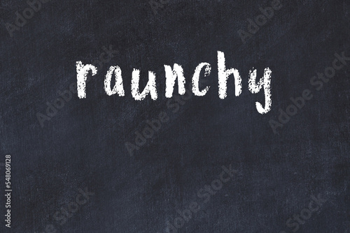 College chalk desk with the word raunchy written on in