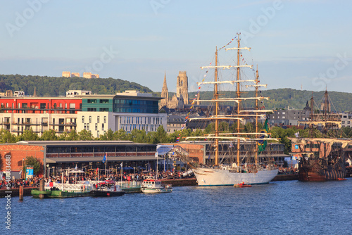 ROUEN, NORMANDY, FRANCE: Armada 2019 gathering of tall ships on the Seine river, crowds of visitors walk on the dock and visit the ships