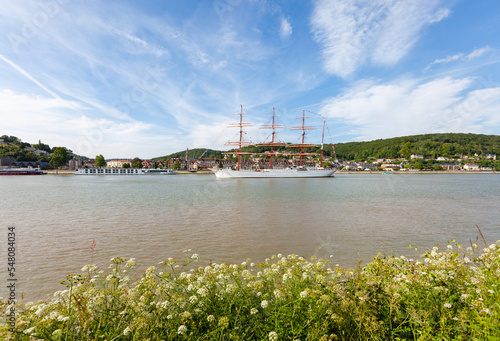 HEURTEAUVILLE, NORMANDY, FRANCE: Armada 2019, russian tall ship Sedov sails from Rouen to the English Channel, on the Seine River, in front of Caudebec-en-Caux