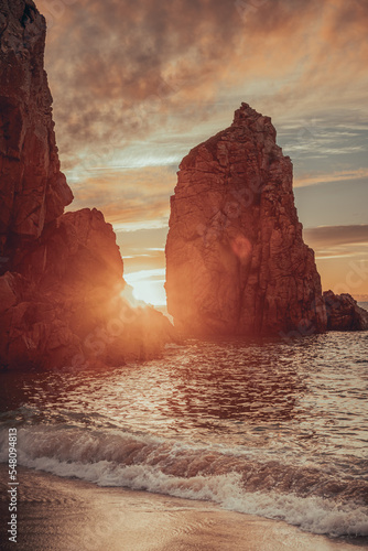 sunset rays. rocks on the ocean shore. incredible views on the beach in Portugal with a beautiful sky