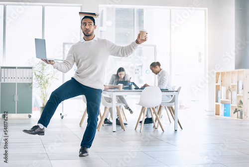 Balance, multitask and busy with a business man carrying a laptop, book and coffee in the boardroom. Assistant, overworked and one leg with a male employee multitasking during a meeting in the office