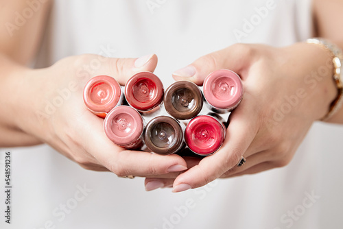 Tattoo ink. Pigments in bottles for tattoos and permanent makeup in woman hands