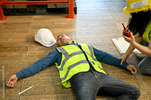 Unconscious man pass out while working in the warehouse, recused by a female colleague.