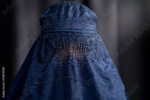 Closeup of Muslim woman in Burka or Burqa, tradition cloths in Afghanistan and West Pakistan, Muslim women wear a burqa covering their face and body