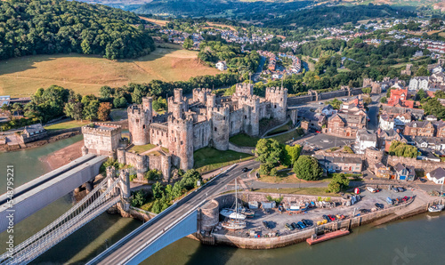 Aerial view with Conwy town and the medieval castle, the famous landmark of Wales and UK, captured in the morning