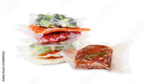 Vacuum packs with different food products on white background