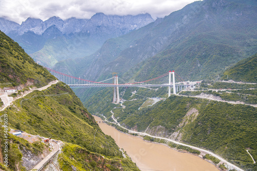 A bridge across Tiger Leaping Gorge and Jinsha River. Located 60 kilometres north of Lijiang, Yunnan, China.
