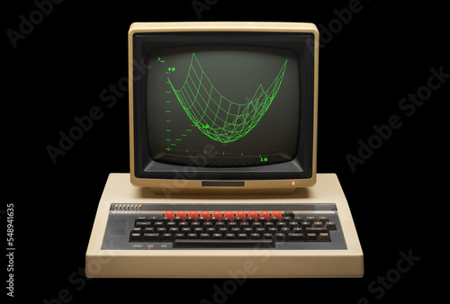 1980s personal computer with monitor frontal view against a black background