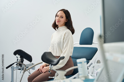 Woman is waiting for a medical examination in gynecological cabinet