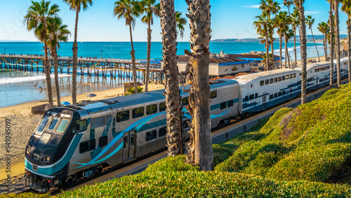Metro commuter train entering San Clemente Pier Beach Station in Southern California