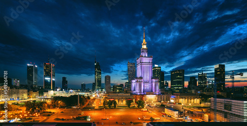 Evening cityscape with city lights - view of the Warsaw downtown and The Palace of Culture and Science. Warsaw. Poland