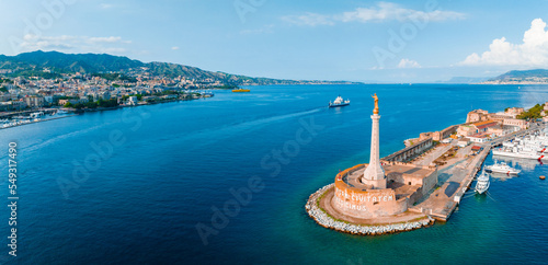 Messina, Sicily, Italy, August 20, 2022. View of the Messina's port with the gold Madonna della Lettera statue