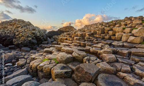 Irish coastline with Volcanic hexagonal basalt columns of Giant`s Causeway at sunset in Northern Ireland