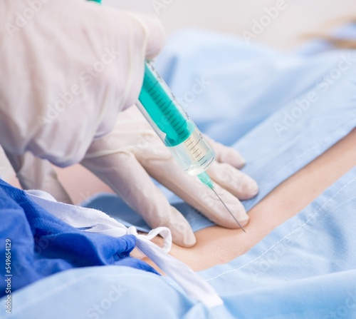 Female patient getting an injection in the clinic