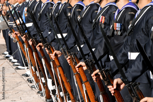 Petty officers of the Italian Navy lined up with musket. Taranto, Puglia, Italy 