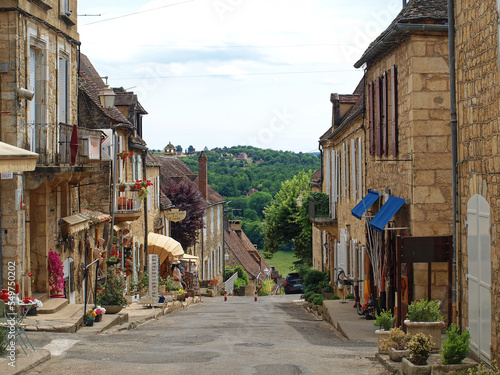 Majestic Bastide of Domme, medieval town of Périgord Noir - Shopping and quiet narrow street with traditional perigordian yellow stone houses, most medieval architecture 