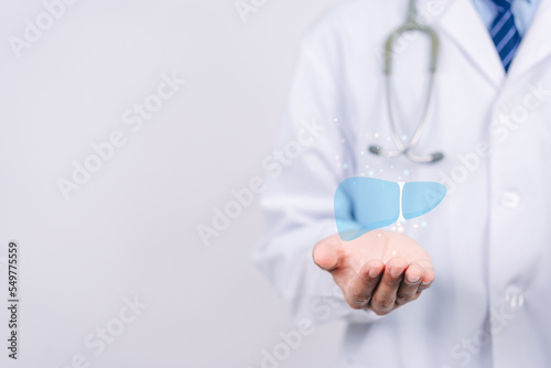 doctor in uniform hands holding liver organ virtual icon, hepatitis vaccination, liver cancer treatment. Health checkup concept.