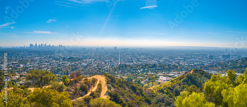 Los Angeles city skyline and natural woodland trails landscape from Griffith Observatory, California, USA