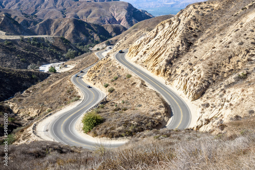 View of winding canyon road on a sunny autumn day