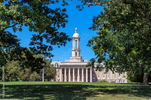 The Old Main building on the campus of Penn State University in sunny morning, University Park, State College, Pennsylvania. 