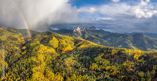 Rainbow in the Colorado Rocky Mountains - Autumn golden aspen leaves - Chimney Rock - County Road 8 
