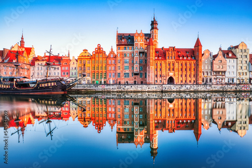 Illuminated Gdansk Old Town with Calm Motlawa River at Sunrise, Poland