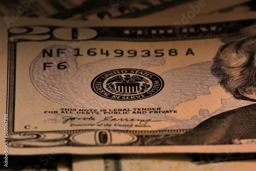 Closeup macro image of US 20 dollar bill and the Federal Reserve symbol