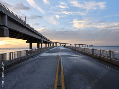 The old Bonner Bridge over the Oregon Inlet now converted to a pedestrian and Fishing pier next to the new Herbert C Bonner bridge construction