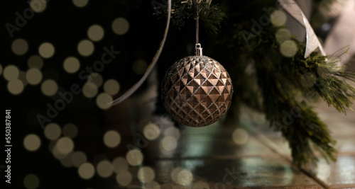 detail of hanging christmas tree ornaments. Christmas background. blurred lights with Bokeh effect. Merry christmas and happy new year concept.