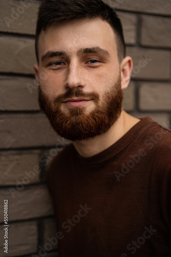 Young handsome man with a red beard, portrait, close-up.