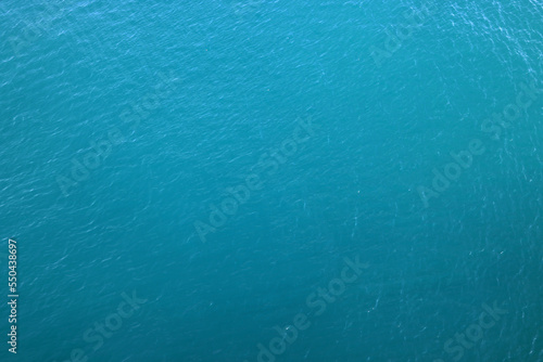 Aerial view of a clear sea water texture. Natural blue background. Blue water reflection. Mediterranean sea. 