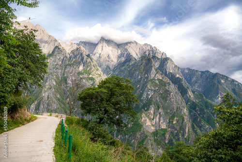Hiking in Tiger Leaping Gorge. Mountains and river. Scenic trail between Shangri-La and Lijiang City, Yunnan Province, Tibet, China.
