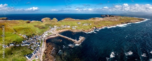 Aerial view of the settlement An Baile Thiar or West Town on Tory Island and harbour, County Donegal, Republic of Ireland