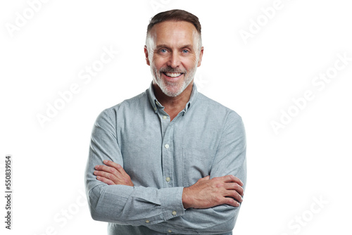 PNG studio portrait of a mature man standing with his arms folded against a grey background
