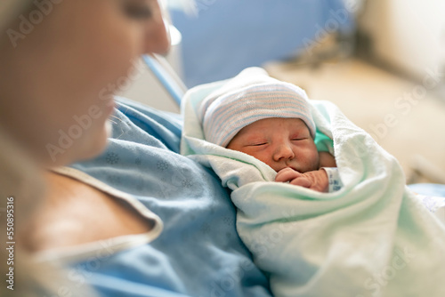 Mother with her newborn baby at the hospital a day after a natural birth labor