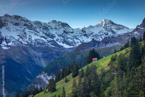Snowcapped Bernese Swiss alps and alpine farms, Switzerland