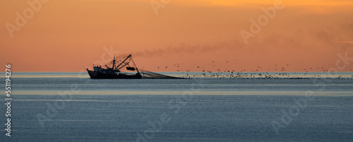 Fishing boat at sunrise