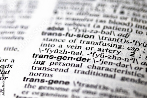 printed word transgender on dictionary page close-up macro definition current events, social issues