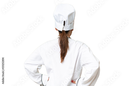 Middle-aged chef woman over isolated background in back position