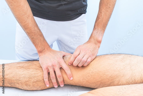 Knee patella mobilization by a physical therapist