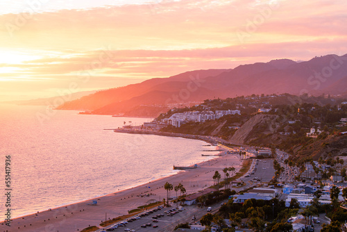 Coastline landscape over Malibu, California during a colorful sunset showing the beach and ocean that you can travel to from pacific palisades