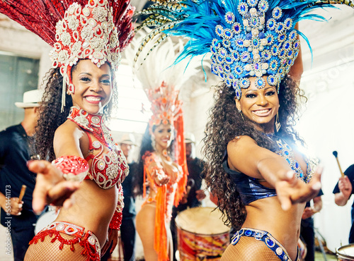 Portrait of women, samba and carnival band in Brazil for celebration, mardi gras and party. Salsa dancers, happy group and music festival performance in rio de janeiro for culture, concert and show