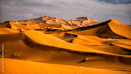 Sahara Desert sand dunes background. Popular travel destination, Erg Chebbi, Sahara Desert, Morocco.